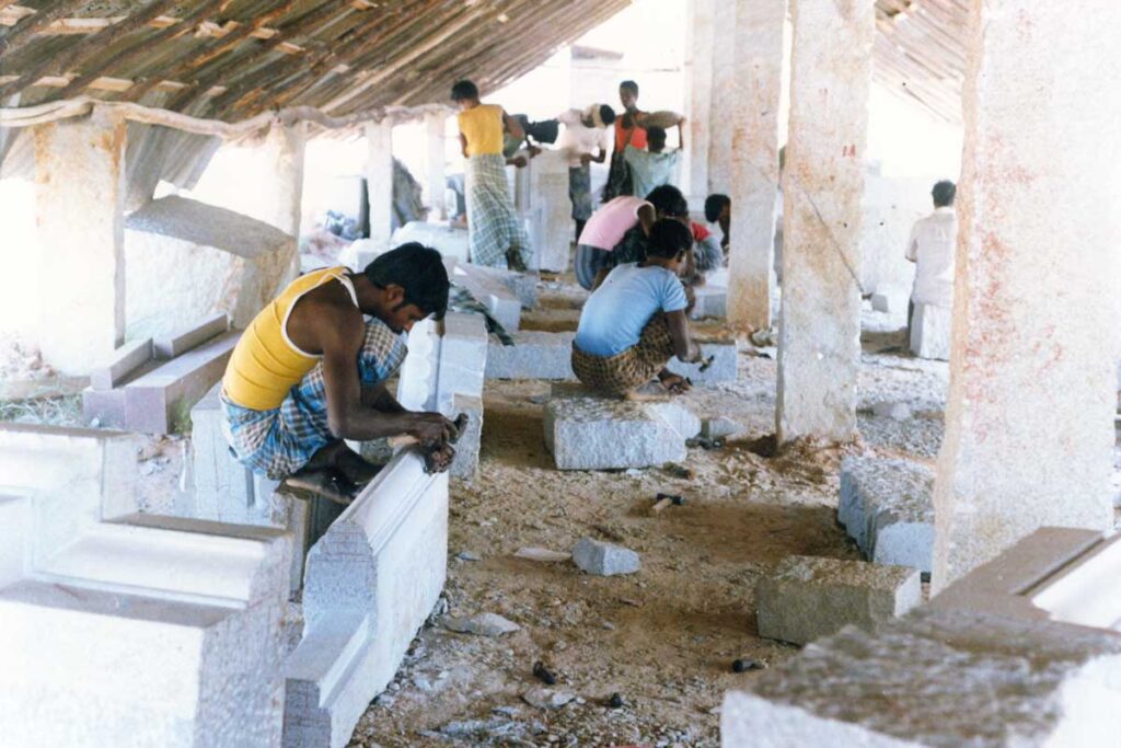 artisans working on pillars for the garbha gudi