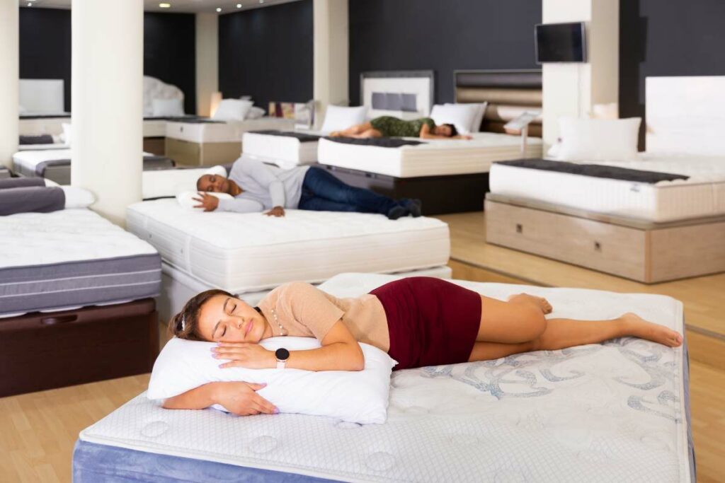 Mattress shopping experience with customer testing comfort level.