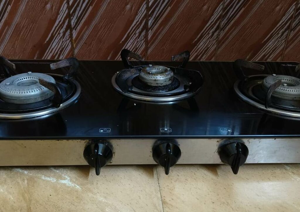 Gas stove with oil stains on surface