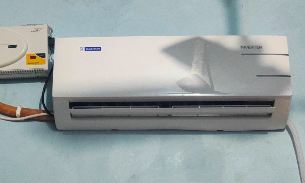 Blue Star 1.5 Ton 5 Star Convertible 5 in 1 Cooling Inverter Split Air Conditioner (IC518YNU) installed in a wall