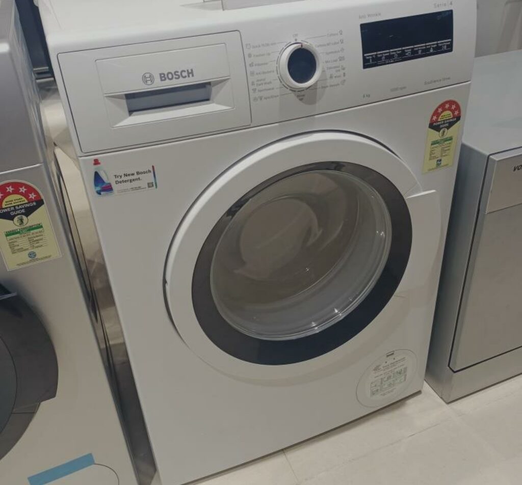 Bosch 7 kg Fully-Automatic Front Loading Washing Machine (WAJ2446SIN) large drum size and energy rating image capture while testing in a store