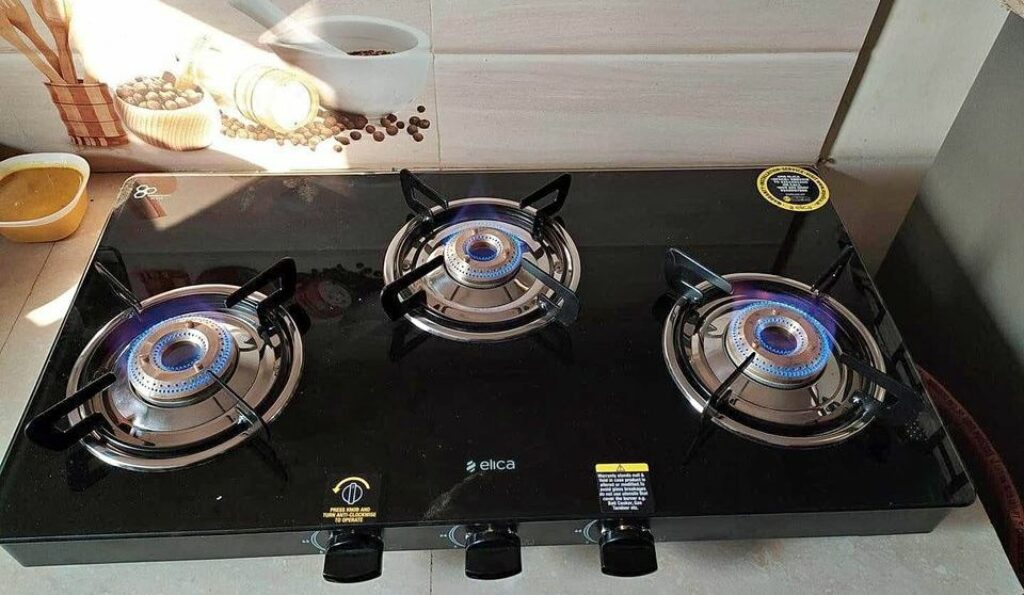 Elica Slimmest 3 Burner Gas Stove with Square Grid and Brass Burner installed in a kitchen