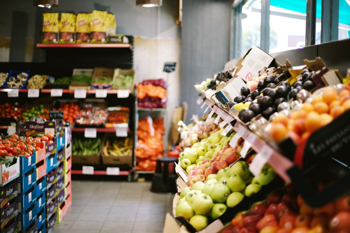 A well-stocked grocery shop showcasing a diverse range of fresh fruits and vegetables.