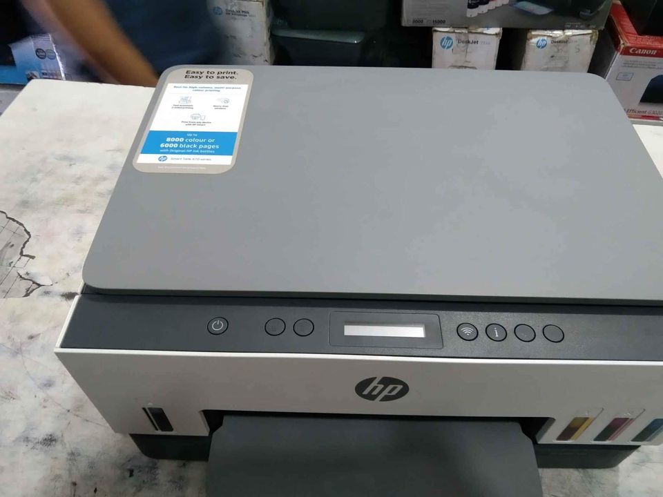 Front view of HP Smart Tank 670 All-in-One Printer showing menu settings and printing functions