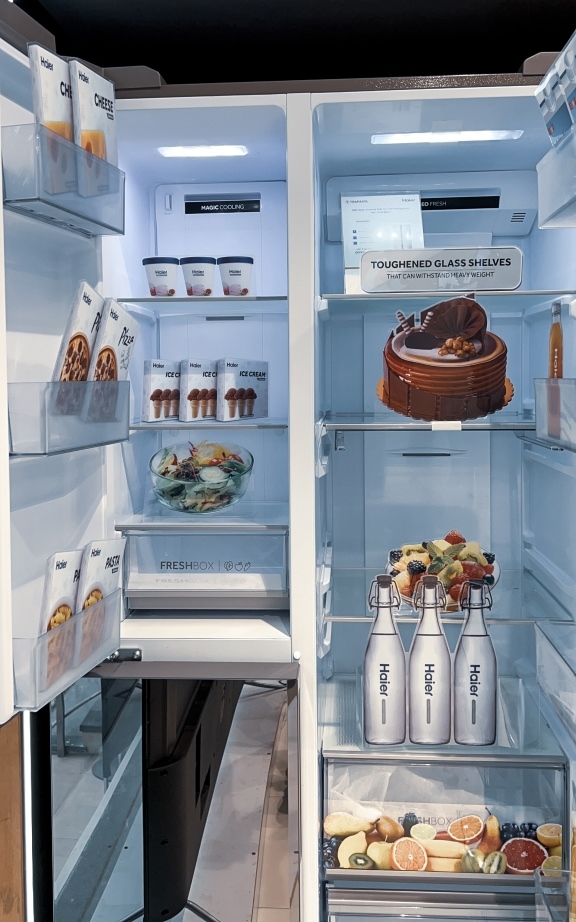 Interior of Haier 602 L Double Door Side By Side showing  a full freezer and a full refrigerator inside